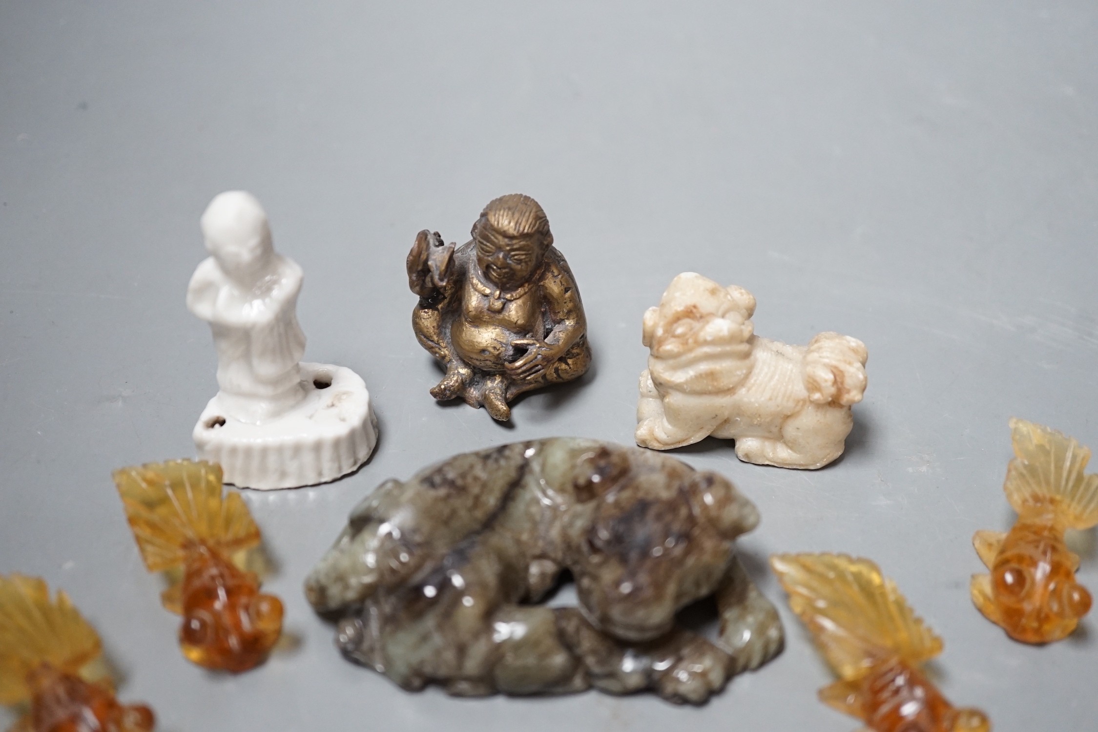 A group of Chinese jade, hardstone, faux amber carvings and models